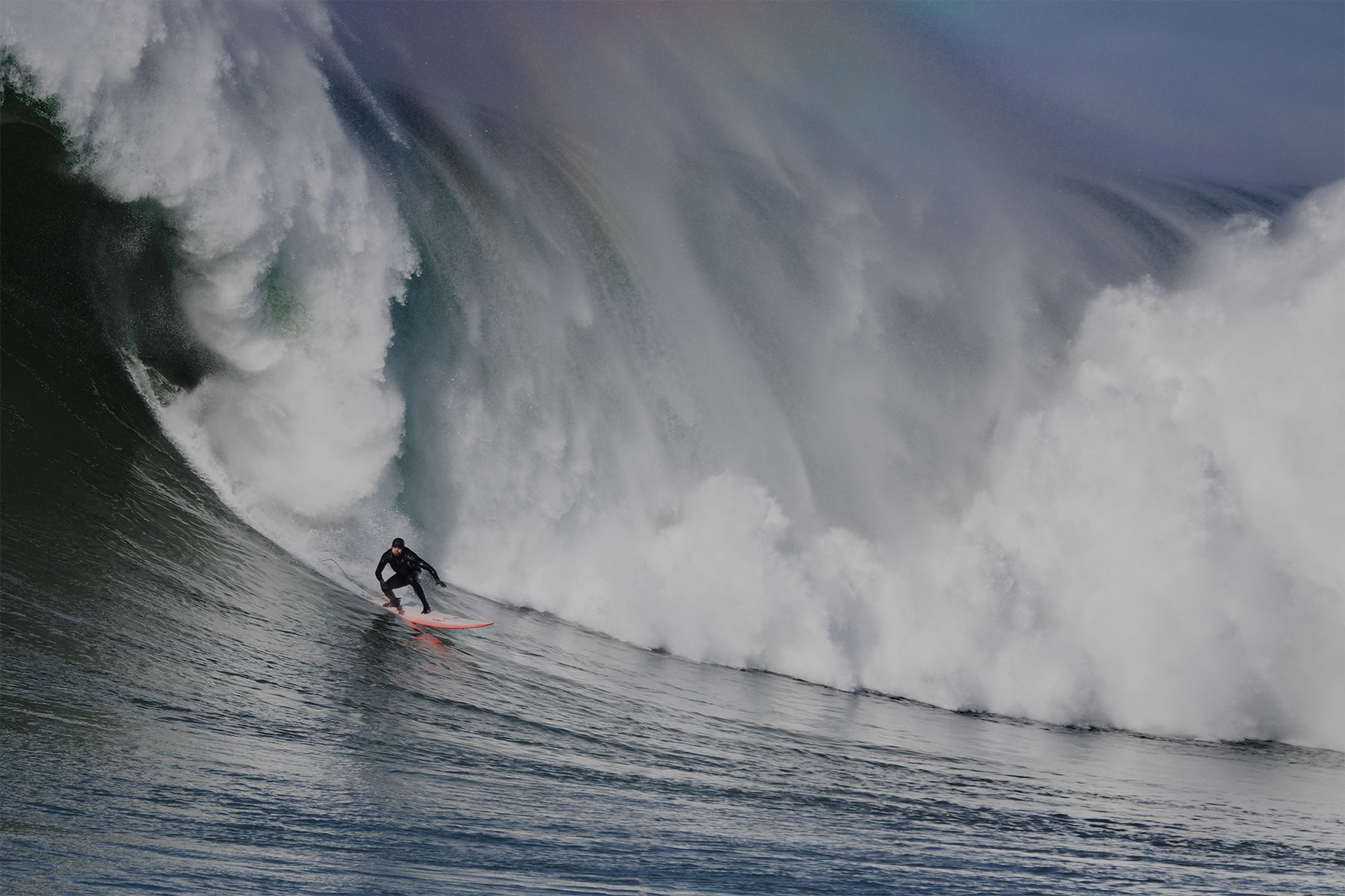 Person surfing big wave