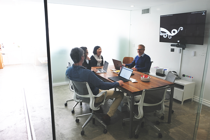 Marker Seven Team in a conference room.