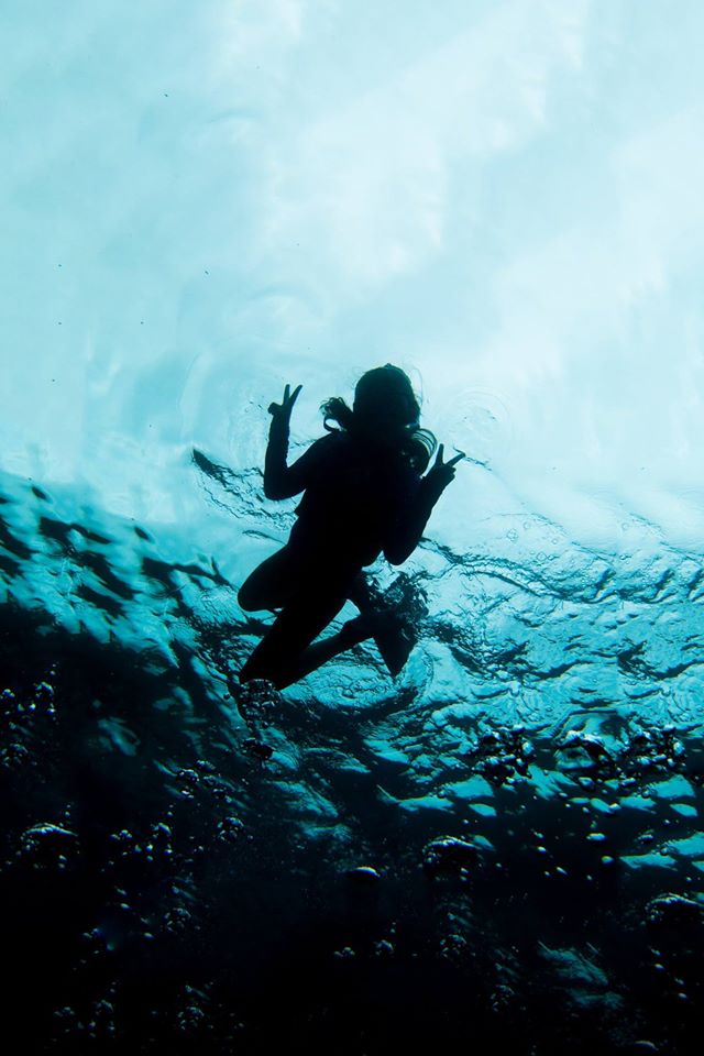 Photograph of a snorkler from below